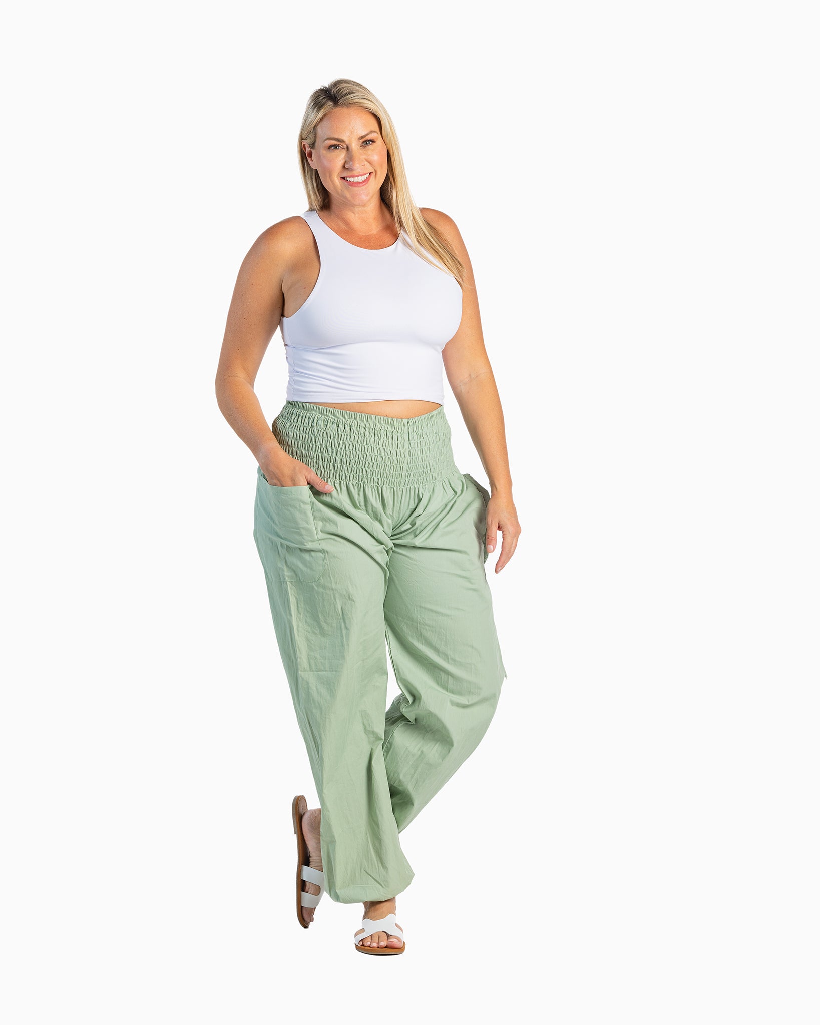 Plus size model in joggers #color_sage