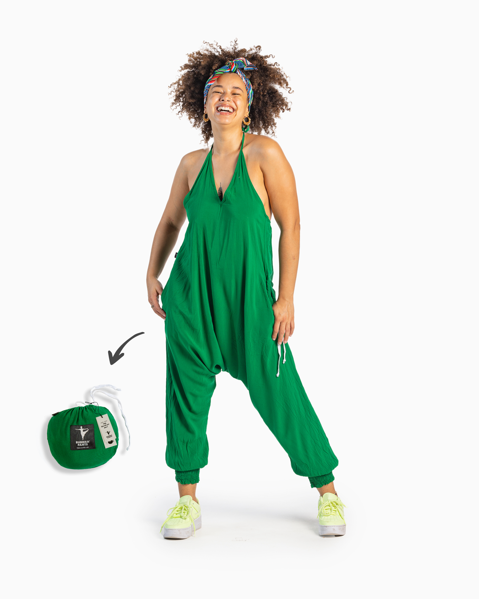 Black model with afro wearing a green jumpsuit with urban aesthetic #color_green